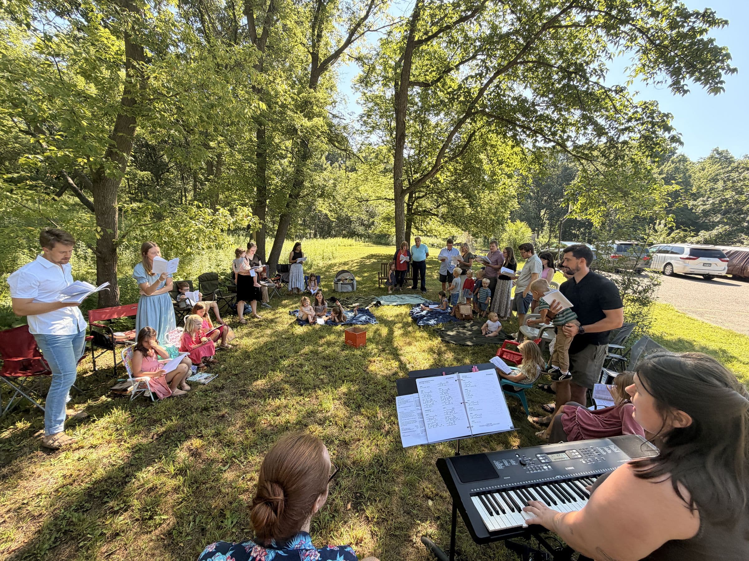 Families from Light House Church worshiping together outdoors
