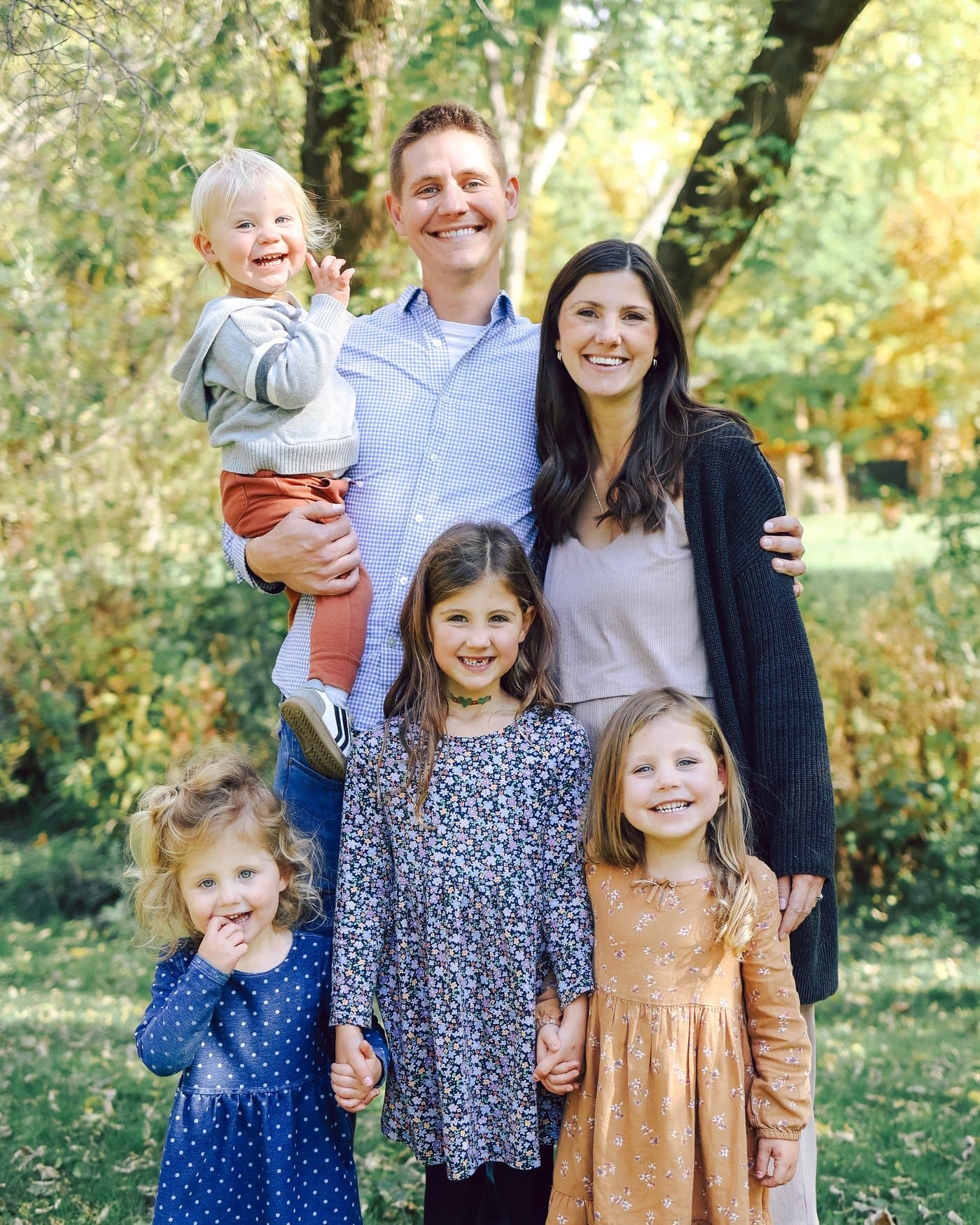 The founder’s family together outdoors in autumn